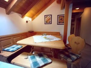 a room with a wooden table and two chairs at Apartment Jutta by Interhome in Guttenberg