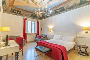 a bedroom with a bed and a living room at Duomo View in Florence