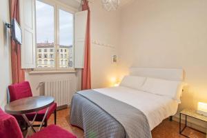 En eller flere senge i et værelse på Duomo View