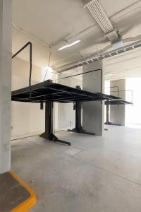 a large black table in a large room at Stylish Condo Steps to Beach & Malecón in Mazatlán