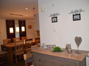 a dining room with a table and some chairs at Apartment FeWo Steinbeisser by Interhome in Arrach