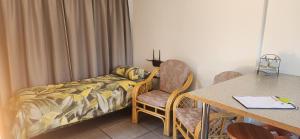 En eller flere senge i et værelse på HartebeesDen