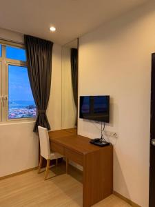 Et tv og/eller underholdning på 118 Apartment Tanjung Tokong by Yen's Sojourn