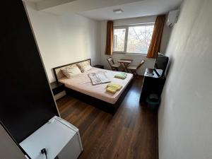 En eller flere senge i et værelse på Dunav Apart