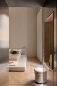 a bedroom with a bed and a mirror at Hotel Trame in Rome