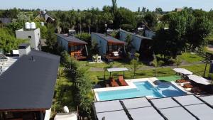 an aerial view of a house with a swimming pool at Cabañas Posta Litoral in Colón +46 photos