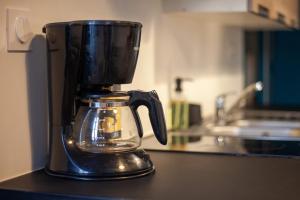 a blender sitting on a counter in a kitchen at Au coeur de la Roche in La Roche-sur-Yon