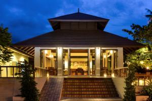 a house with a staircase leading up to it at PingChan Koh Phangan Beachfront Resort in Thong Nai Pan Yai