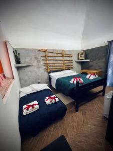 En eller flere senge i et værelse på Bilocale vista Etna con parcheggio