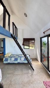 a bedroom with a bunk bed in a room at Beach chalet with Private Pool in Heroica Alvarado +30 photos