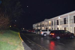 a row of cars parked in front of a building at New Travel Inn in Kingsport