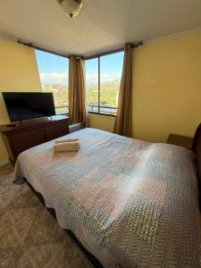 En eller flere senge i et værelse på Dept Hermosa Vista, Las Condes