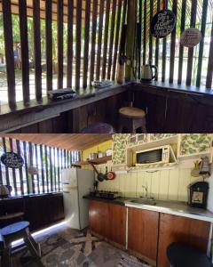 una cucina con lavandino, piano cottura e forno a microonde di Casa Mamré a Cahuita