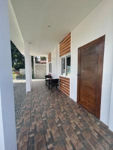 a hallway of a house with a wooden door at Casa B Pasco in Dauin