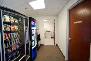 a hallway in an office with a vending machine at Pleasant Night Inn Carthage Near Fort Drum in West Carthage