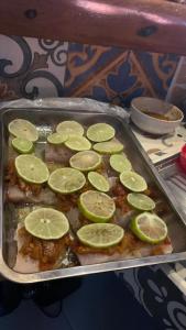 a tray of food with lime slices on it at Hotel Carmen Costa Coral in Tambor