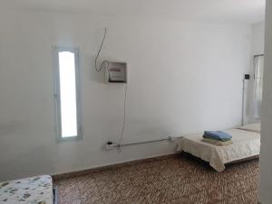 En eller flere senge i et værelse på Las Vertientes