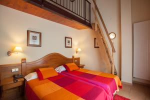 Letto o letti in una camera di Hotel Montané