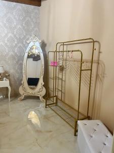 a dressing room with a mirror and a dressing table at B&B temptation in CTA +10 photos