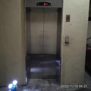 an elevator in a building with its door open at Condo Unit 5A in Batangas City in Batangas City