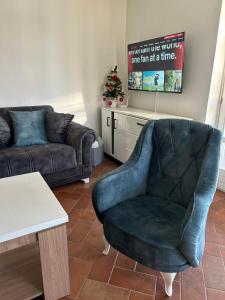 a living room with a couch and a chair at Villa Ela in Prijedor