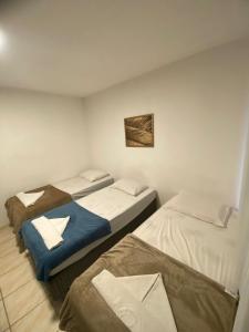 a room with three beds in a room at Pousada Rota Beach in Porto De Galinhas +52 photos