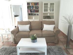 a living room with a couch and a table at Apartment Marie-Luise by Interhome in Ferchesar