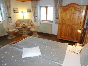 a living room under construction with a table and chairs at Apartment Bärli by Interhome in Bad Bayersoien