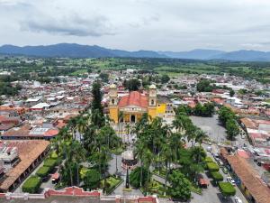 an aerial view of a city with palm trees at Plaza Real Hotel Boutique in Coscomatepec de Bravo