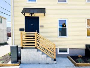 a house with a wooden ramp leading to a door at The Return - Multi-Unit Retreat - Sleeps 16 - Spa in Warren