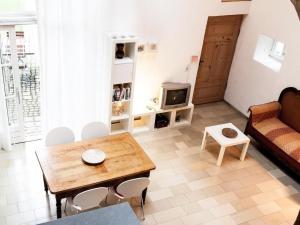 a living room with a couch and a table at Apartment Studio by Interhome in Schernfeld +11 photos