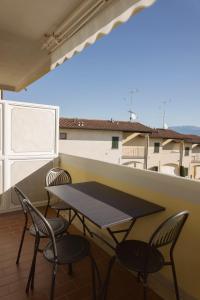 a table and chairs on a balcony with a view at Blu Garda View in Polpenazze del Garda