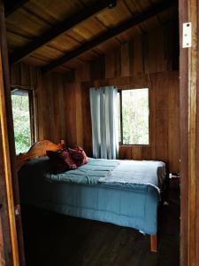 Postel nebo postele na pokoji v ubytování Rio Paquita Lodge