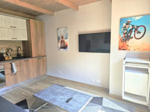 a living room with a bike on the wall at Moda Apartments 69 in Sestriere