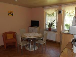 a dining room with a table and chairs at Apartment Saydaer Höhe by Interhome in Sayda
