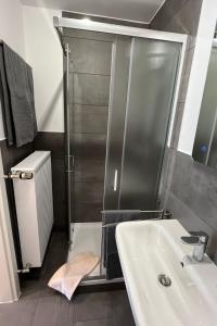 a bathroom with a shower and a sink at Apartment Haus Budinger by Interhome in Alf