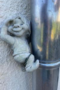 a statue of a child leaning against a pole at Holiday Home Klosterwald by Interhome in Dargun +41 photos