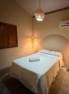 En eller flere senge i et værelse på Villa Vento Caraiva