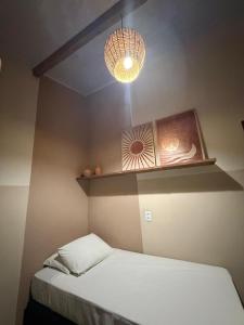 En eller flere senge i et værelse på Villa Vento Caraiva