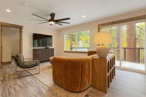 a living room with a ceiling fan and a couch at NEW 2BR w/ Ski Views, Bunk Room & Resort Access in Durango Mountain Resort