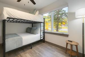 a bedroom with a bunk bed and a window at NEW 2BR w/ Ski Views, Bunk Room & Resort Access in Durango Mountain Resort +28 photos