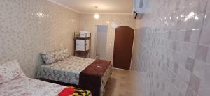 a small room with two beds and a small room with a bed sqor at "Taberna dos Castilho" in Bertioga