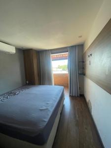 En eller flere senge i et værelse på Casa Alto Padrão Palmeiras