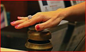 a woman with her hand on the top of a knob at Hotel Meeting in Ciampino