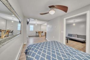 a bedroom with a blue bed and a living room at Cozy Private Suite in Worcester +22 photos