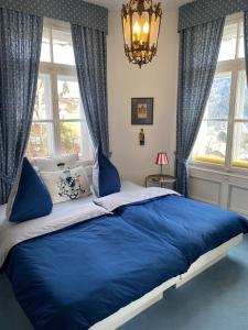 En eller flere senge i et værelse på Villa Marktresidenz