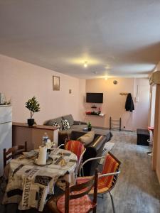 a living room with a couch and a table at Carthage in Vierzon