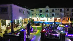 a group of people in a courtyard at night at Dellagio Hotel in Wa +45 photos