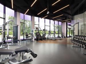 a gym with a lot of treadmills and machines at Mercure Warszawa Ursus Station in Warsaw