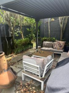 Et opholdsområde på Myrtle St Guesthouse